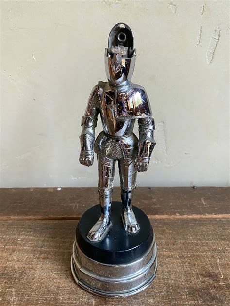 steel knight lighter music box|Vintage 1960s Musical Knight in Armor Table Lighter.